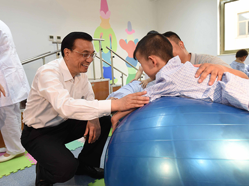 這三年，總理牽掛的殘疾人群體，迎來哪些暖政？