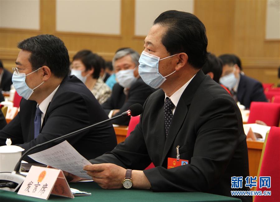 （兩會&middot;熱點畫報）（11）代表委員建言統(tǒng)籌做好經(jīng)濟社會發(fā)展工作